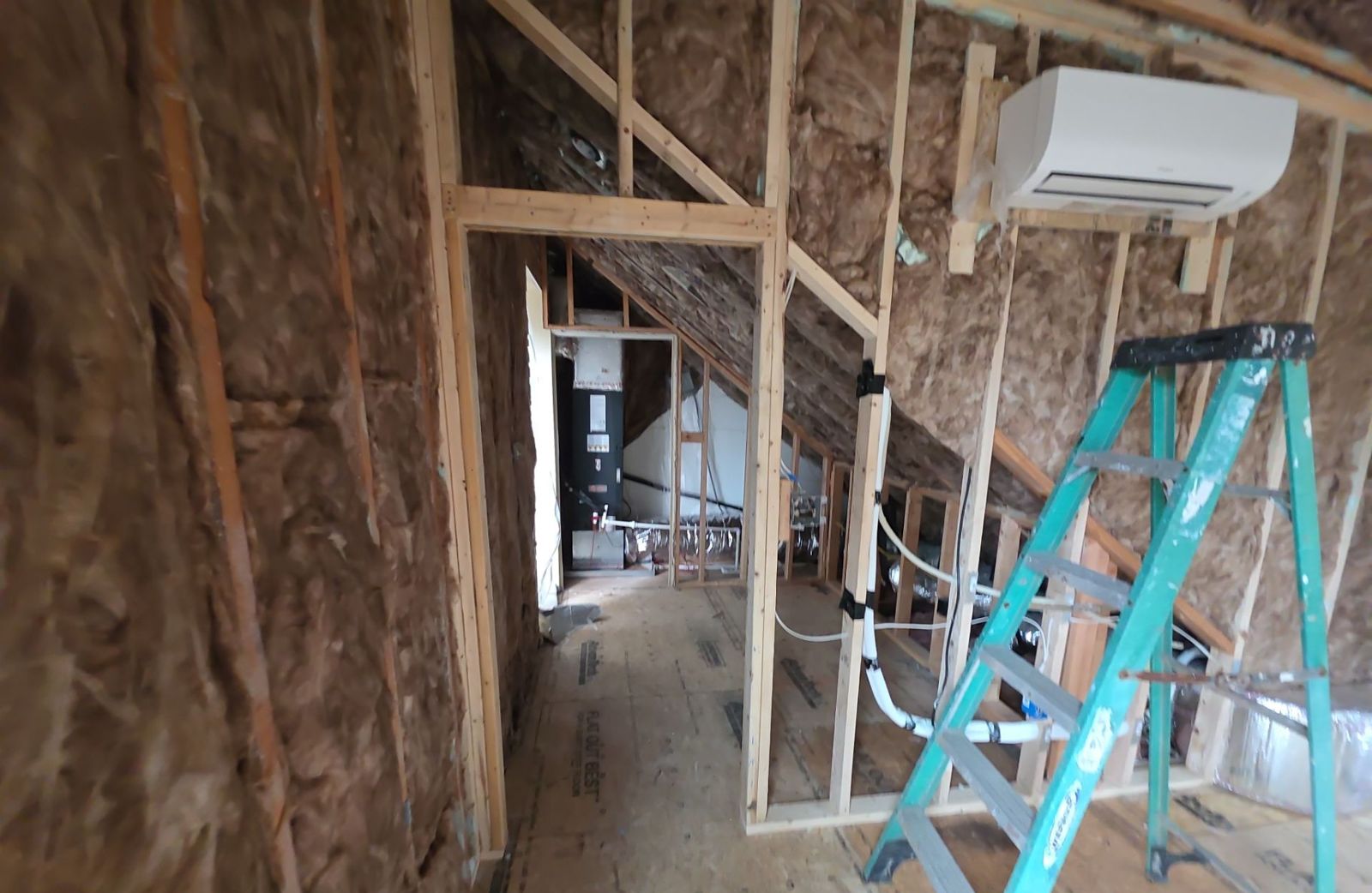 Framed hallway with mini split and air handler closet