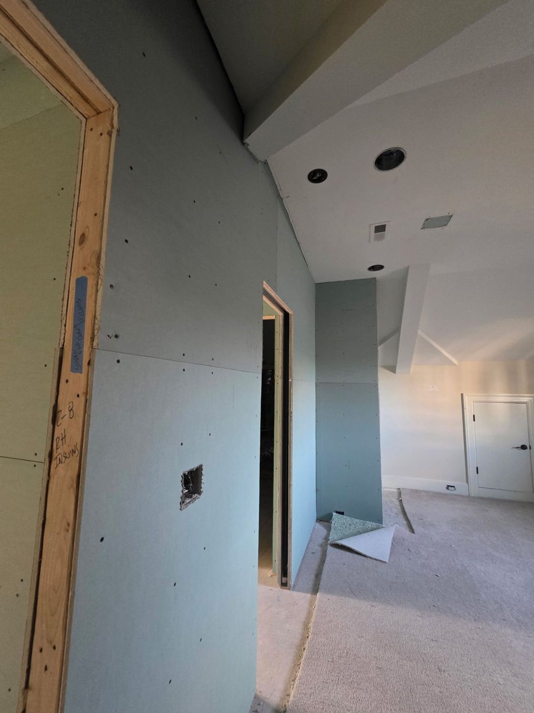 New drywall walls and ceiling in a bedroom